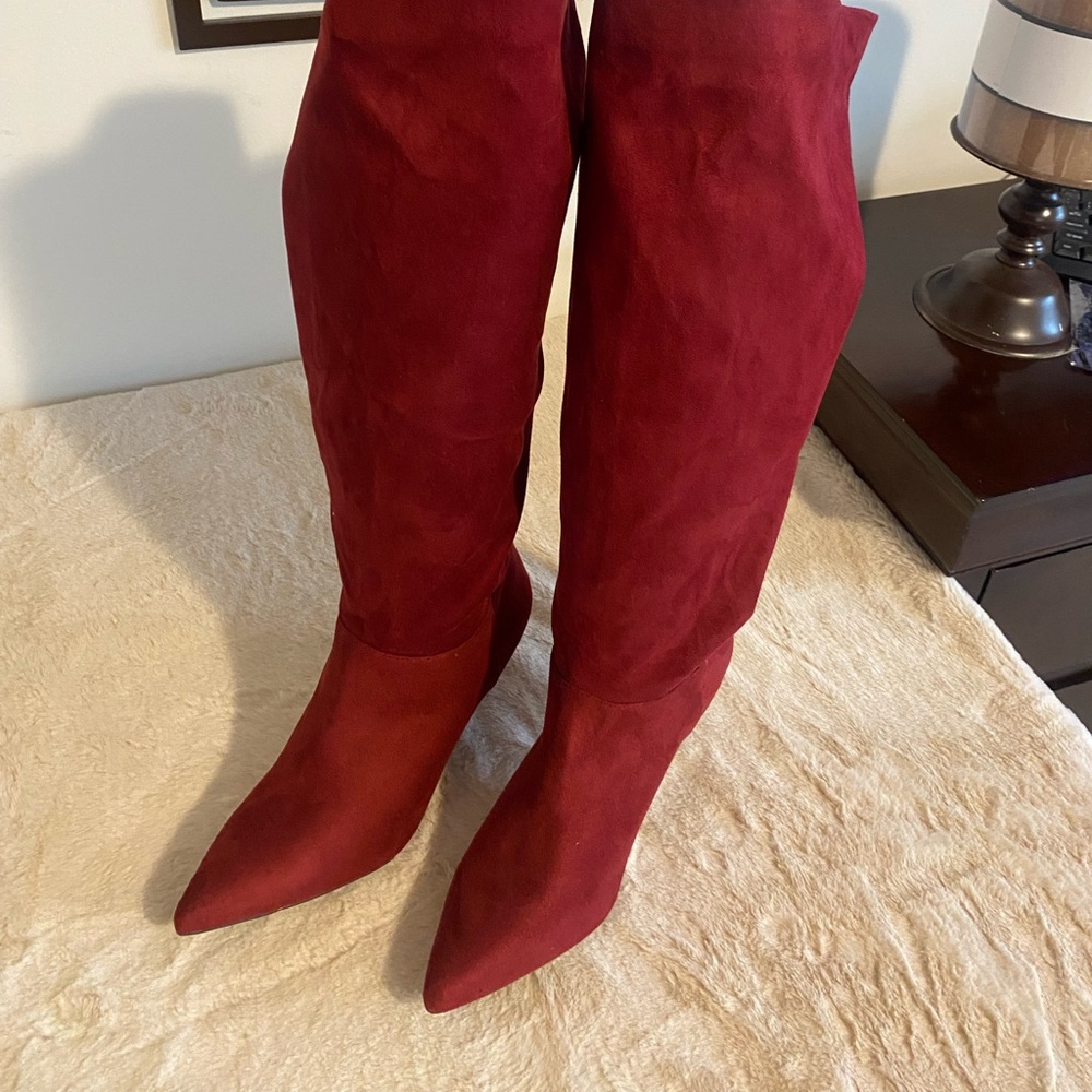 Size 11 can fit size 10. point toe red faux suede knee high boots